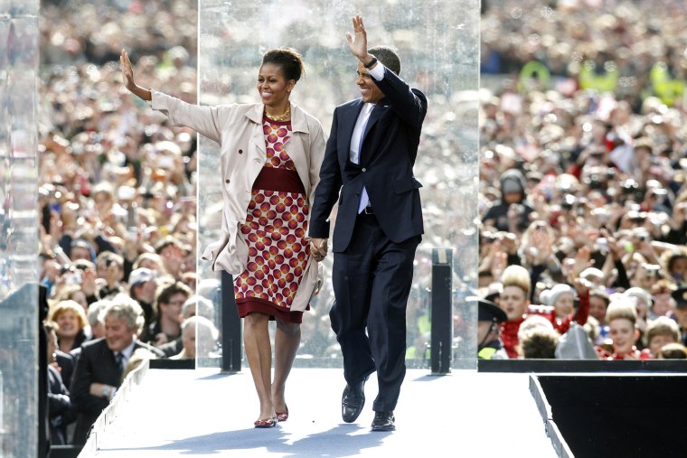 Image: U.S. President Barack Obama and first lady Michelle Obama wave to the crowd at College Green in Dublin